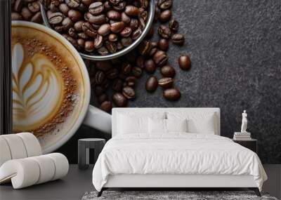  A cup of coffee atop the table, beside it, coffees beans and a coffee scoop await Wall mural