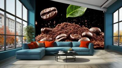  A mound of coffee beans topped with a single green leaf Wall mural