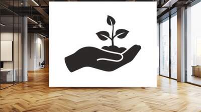 Plant in hand. Vector icon. Wall mural