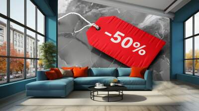 Red -50% discount tag on marble-style background, perfect for sales promotions Wall mural