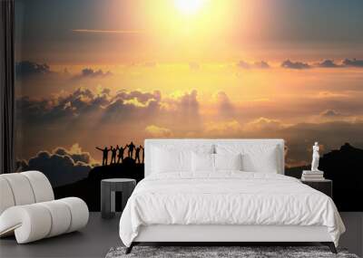 On the top of the world together. A group of people stands on a hill over the beautiful cloudscape. Wall mural