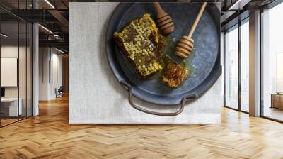 Honey comb on a tin tray on linen tablecloths. Rustic style. Wall mural