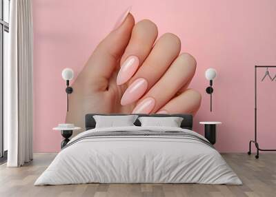 female hand with pink french nails on a pink background Wall mural