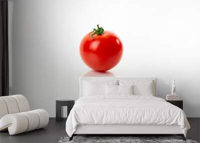 One juicy fresh red ripe tomatoes closeup on a white background with reflection. Wall mural