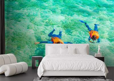 Couple snorkeling in tropical Maldives island . Wall mural