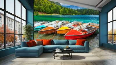 Stunning alpine landscape and colorful boats,Lake Fusine,Italy Wall mural