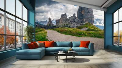 Wide pebbly hiking trail and Cinque Torri rock formations, Dolomites Wall mural