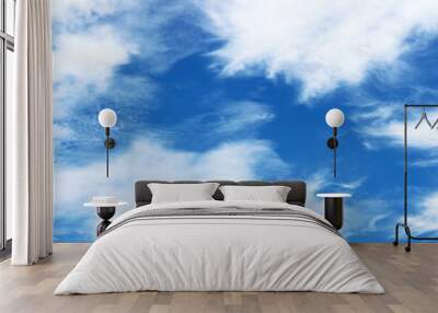 Bright blue sky with white clouds Wall mural