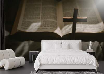 Crucifixion of Jesus christ ,cross with the holy bible at sunlight. Wall mural