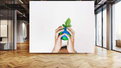 Hands children holding the world made from clay and tree on top, Eco friendly concept Wall mural