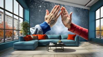 Slow-motion high-five between two hands frozen in time, high five, frozen, movement, motion, hands, teamwork Wall mural