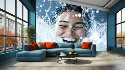 Birds-eye view of a refreshing water splash hitting a joyful face, photorealistic detail, crisp clarity, play of light and water droplets, dynamic and invigorating Wall mural