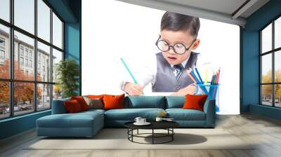 cute boy drawing with colorful crayons isolated over white Wall mural