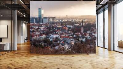 Aerial view of Gdansk, town in Poland, red roofs of old houses, commercial modern building in the back with beautiful cloudy sky in the background Wall mural