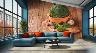 Green delicious broccoli on a wooden rustic table Wall mural