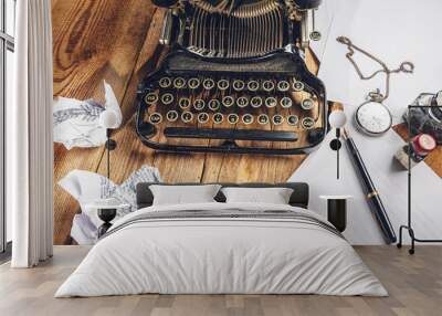 Text prescribed on a vintage typewriter and watch timekeeper. Wall mural