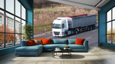 White lorry with tipping trailer in motion on the motorway Wall mural