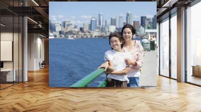 two sisters on ferry deck with seattle skyline in background Wall mural