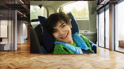 Young disabled boy in wheelchair traveling in handicap vehicle Wall mural