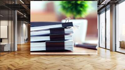 Stack of documents placed on a business desk in a business office. Wall mural