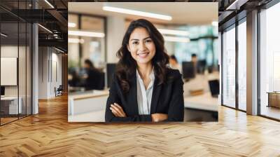 Smiling young asian businesswoman in the office. Wall mural