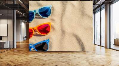 Sandy beach with different types of modern sunglasses Wall mural