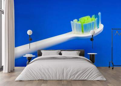 Electric toothbrush at blue background Wall mural