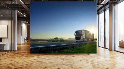 Large Transportation Truck on a highway road through the countryside at sunset Wall mural