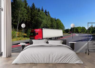 Red truck transport on the road and cargo  Wall mural