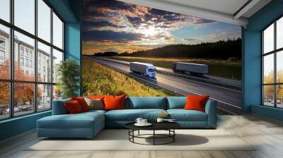 Two white trucks transport on the road at sunset and cargo Wall mural