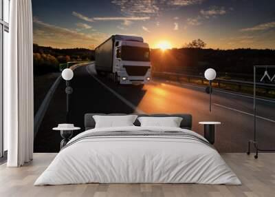 Truck transportation on the road at sunset  Wall mural