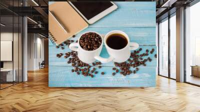 Two cup of hot coffee and roast seeds coffee  on wooden background. Wall mural