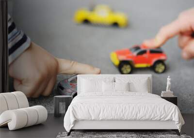 Innocence, childhood concept - playing with toy car Wall mural