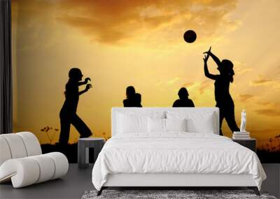 Silhouette, group of happy children playing on meadow Wall mural