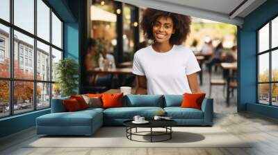 Beautiful black woman wearing bella canvas white t shirt and jeans, at cafe. Design t shirt template, print presentation mockup Wall mural