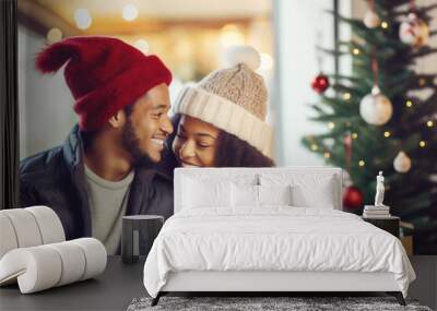 Closeup photo of cute couple spending holly Christmas eve in decorated garland lights house near Chrismas tree outdoors Wall mural