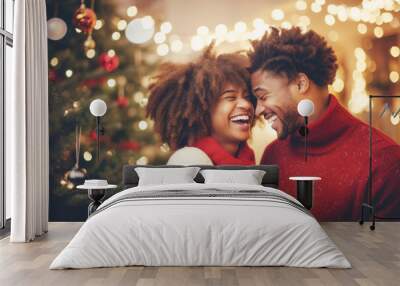 Closeup photo of cute couple spending holly Christmas eve in decorated garland lights house near Chrismas tree outdoors Wall mural