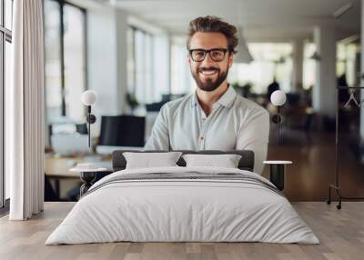 confident and smiling handsome hipster man standing in the office Wall mural