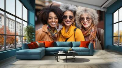 Happy multiracial trendy mature women having fun together outdoor at city street. Friendship lifestyle concept Wall mural