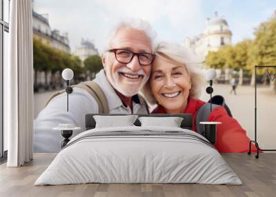 Happy Older Couple take selfie on vacation, Paris in background. Funny senior couple arrive at their vacation spot in Paris France Wall mural