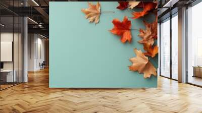 Maple leaves on blue background, autumn background with copy space.	
 Wall mural