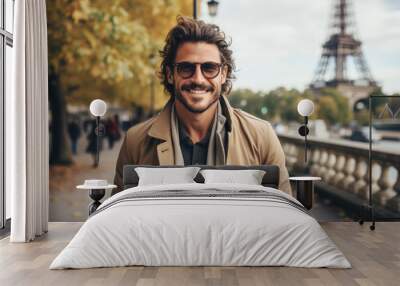 Portrait of a attractive smiling man standing on the street of Paris Wall mural