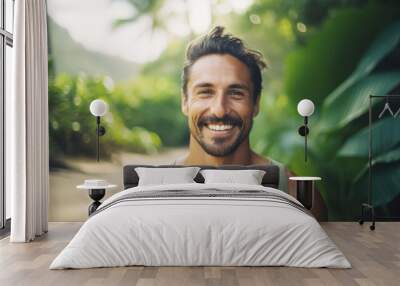 Portrait of a happy and smiling man, yoga teacher on tropical island Wall mural