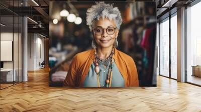 Portrait of a hipster smiling senior black woman, clothing store owner Wall mural