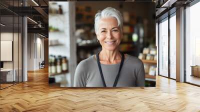 Portrait of a smiling senior  woman, healthy food store owner Wall mural