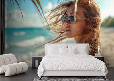 Portrait of a young beautiful woman with long windy hair on the beach  Wall mural