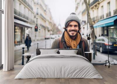 Portrait of a young smiling man standing on the city street in Paris Wall mural