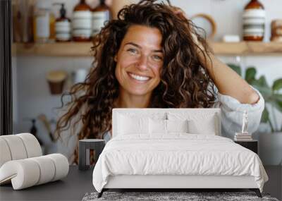 Portrait of happy young attractive woman with long curly hair at home Wall mural