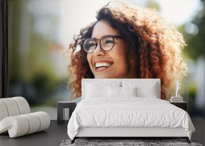 Portrait of happy young woman wearing glasses outdoors	 Wall mural