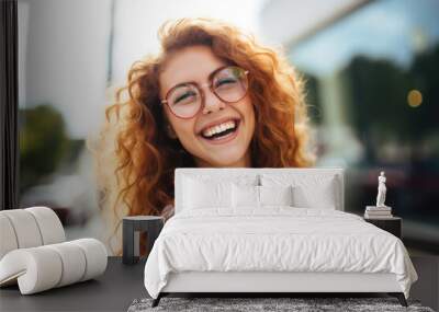 Portrait of happy young woman wearing glasses outdoors	 Wall mural